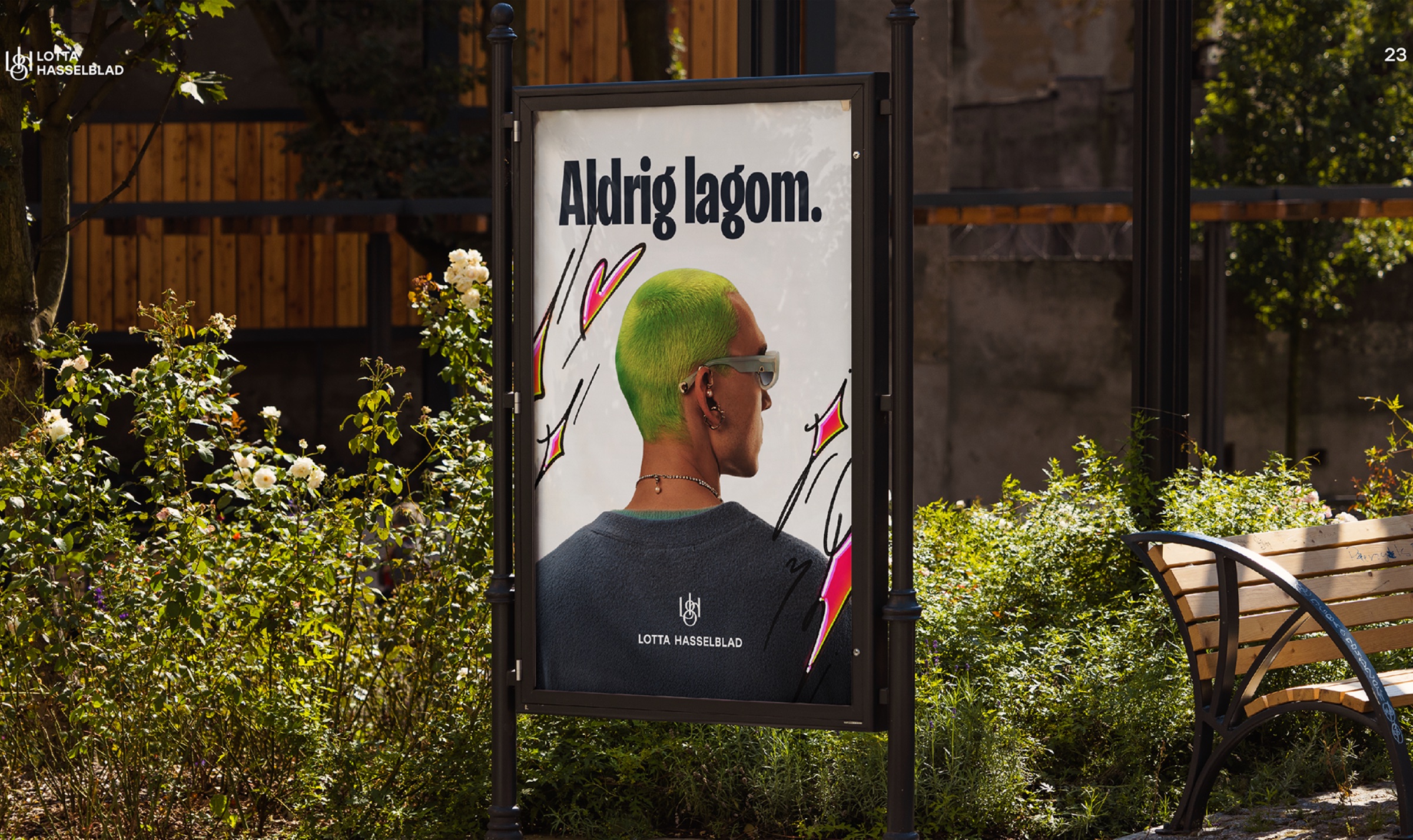 “Aldrig lagom.” poster in a park display case, showing a person with green hair